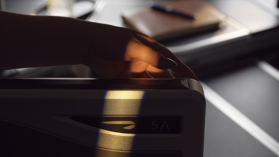 A detail of an arm rest on a British Airways airplane.