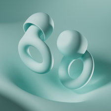 Loop earplugs on a silky, mint coloured background.