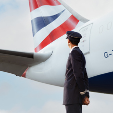 A British Airways pilot looking at his 787 plane.