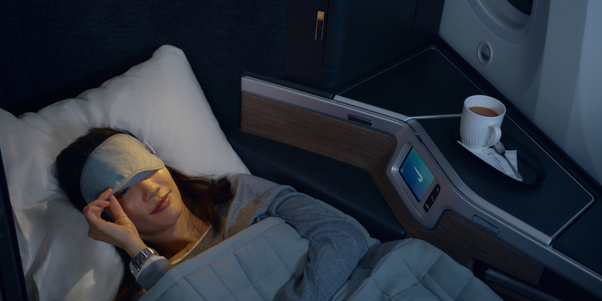 A woman falling asleep on a British Airways flight.