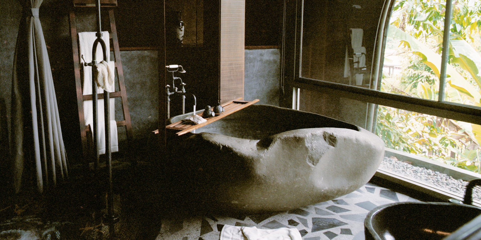 A room with a strange rock shaped bath at Keemala.