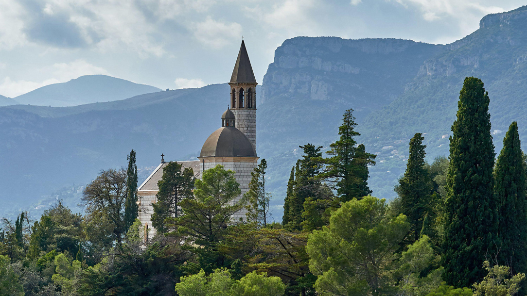 Chateau De Bellet outlined against the hills.