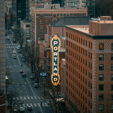 looking down on a street sign saying Portland.