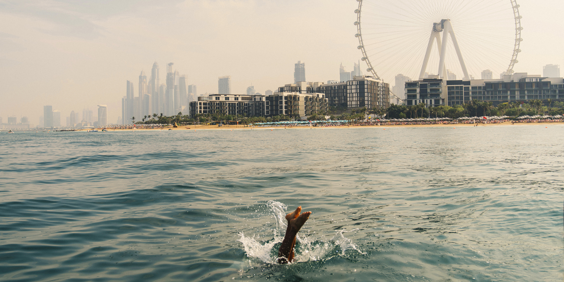 A person diving into the sea in Dubai.