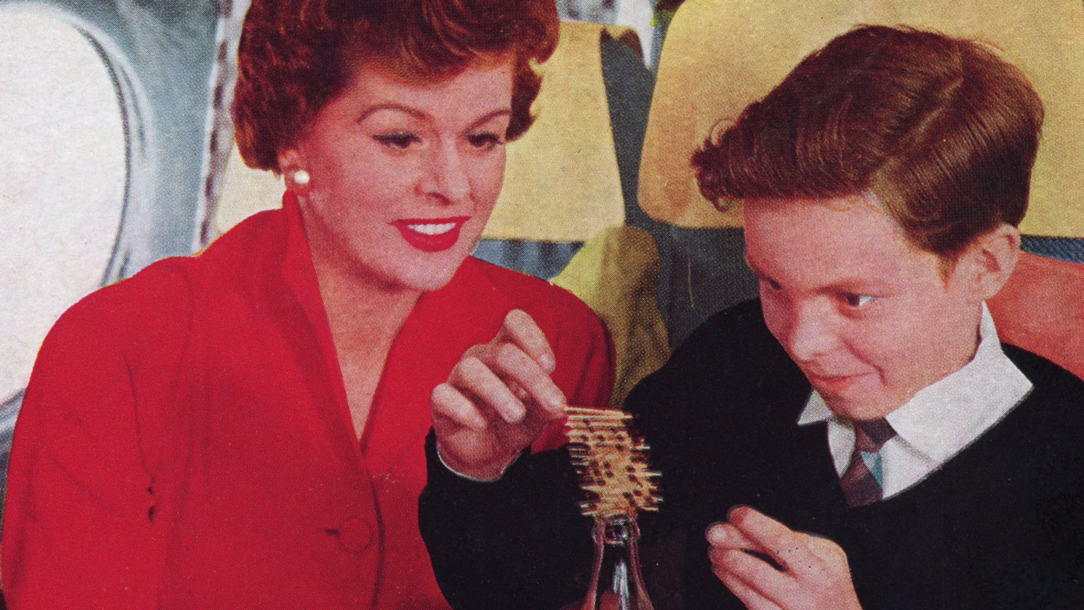 A mother and son playing a game on an old airplane.