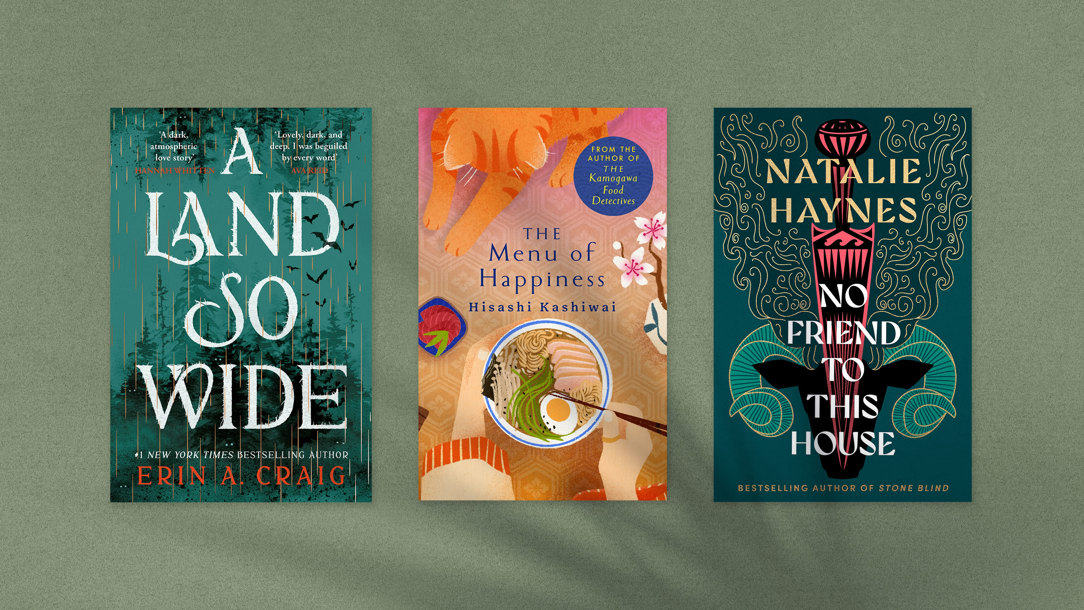 Book jackets on a green background with the shadow of leaves.